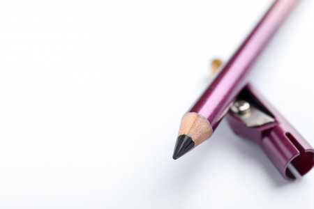 Purple eye liner and sharpener on white background, closeup. Space for textの写真素材