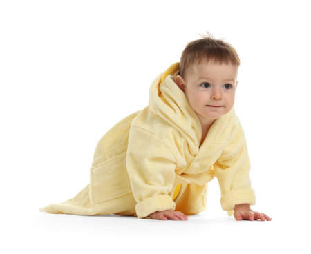 Cute baby in bathrobe on white backgroundの写真素材