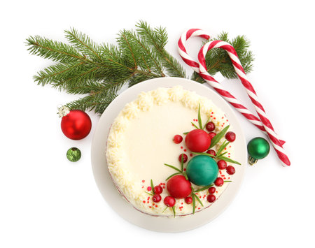 Delicious sponge cake with Christmas decor and red currants on white background, top viewの写真素材