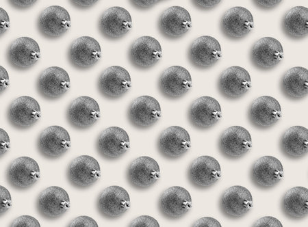 Christmas balls on light gray background. Pattern design