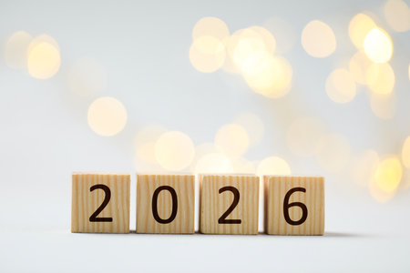 New 2026 year. Cubes with numbers on light background, bokeh effectの写真素材