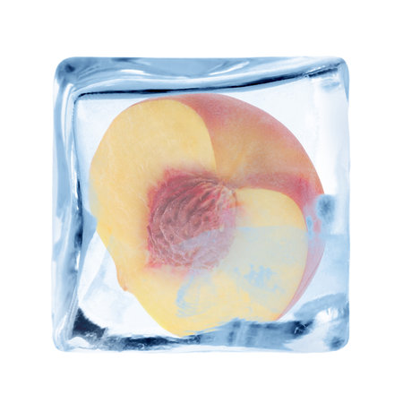 Half of peach in ice cube isolated on whiteの写真素材