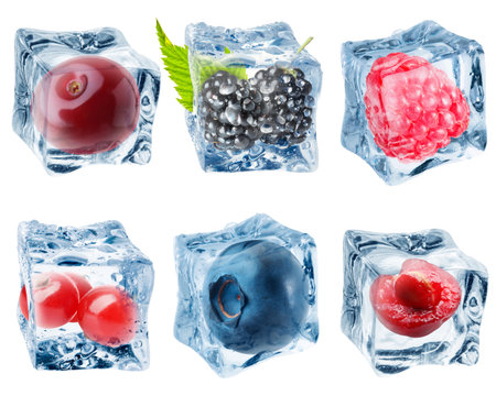 Clear ice cubes with berries isolated on white, setの写真素材