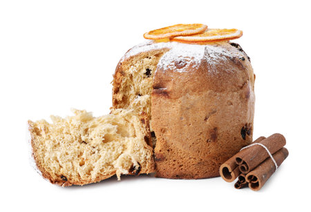 Christmas food. Delicious Panettone cake, orange slices and cinnamon isolated on whiteの写真素材