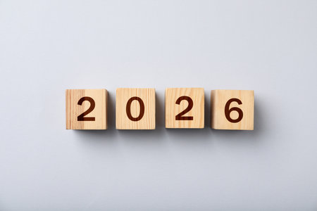 Cubes with numbers on light gray background, top view