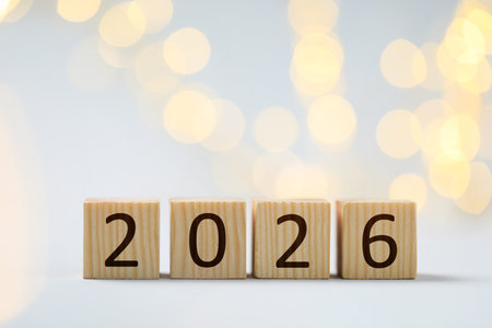 New 2026 year. Cubes with numbers on light background, bokeh effectの写真素材