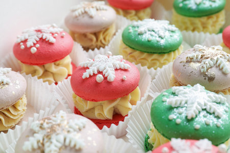 Festively decorated macarons in box, closeup. Christmas treatの写真素材