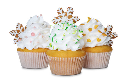 Tasty cupcakes with Christmas decor isolated on whiteの写真素材