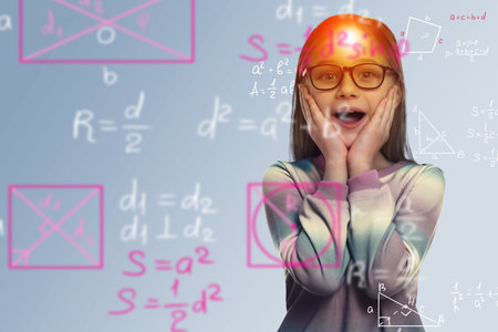 Studying science. Double exposure of child and illustrations related to mathematics. Surprised girl on gray backgroundの写真素材