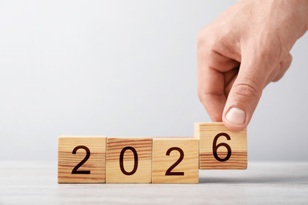 Man putting cube with number 6 at white table, closeup