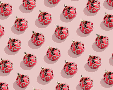 Festive pattern of beautiful Christmas balls. Repetitive ornament on pink backgroundの写真素材