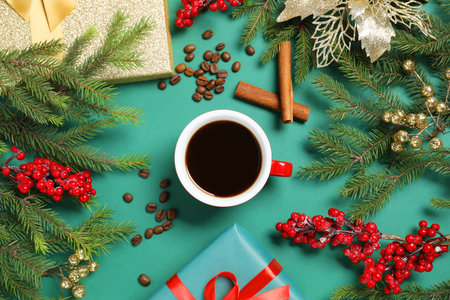 Flat lay composition with cup of aromatic coffee, fir tree branches and gift boxes on green backgroundの写真素材