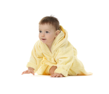 Cute baby in bathrobe on white backgroundの写真素材