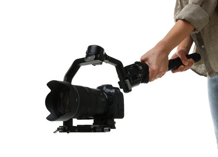 Videographer using gimbal stabilizer with camera on white background, closeup