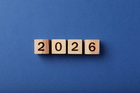 Cubes with numbers on blue background, top view