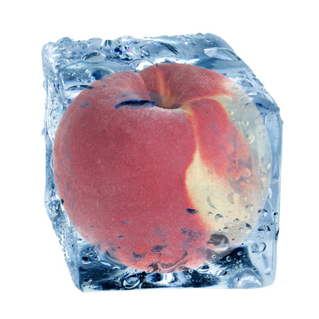 Fresh peach in ice cube isolated on whiteの写真素材