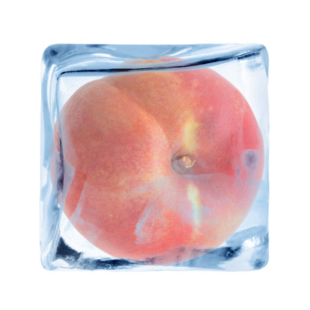 Fresh peach in ice cube isolated on whiteの写真素材