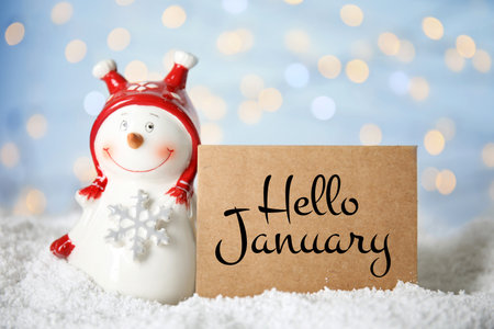 Hello January card, snowman and bokeh lights on backgroundの写真素材