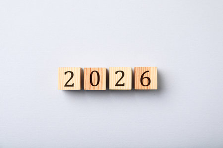 Cubes with numbers on light gray background, top view