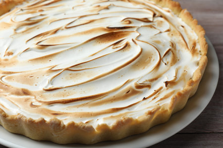 Delicious meringue pie on wooden table, closeupの写真素材
