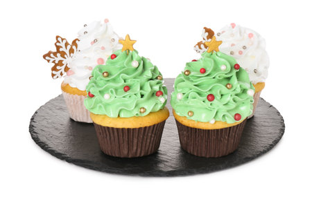 Festively decorated Christmas cupcakes isolated on whiteの写真素材