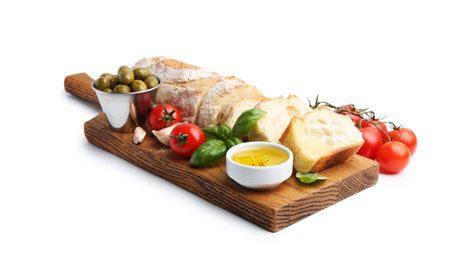 Tasty baguette, tomatoes, olives and basil isolated on whiteの写真素材