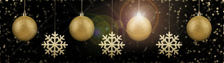 Christmas balls and snowflakes against black background with bokeh lights. Beautiful festive ornamentsの写真素材