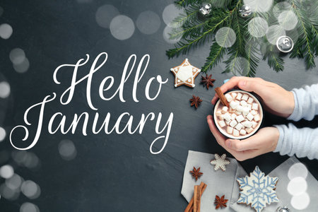 Woman holding cocoa with marshmallows and Christmas cookies, closeupの写真素材