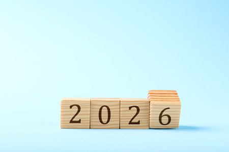 New 2026 year. Cubes with numbers on light blue backgroundの写真素材