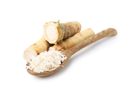 Grated horseradish and roots isolated on whiteの写真素材