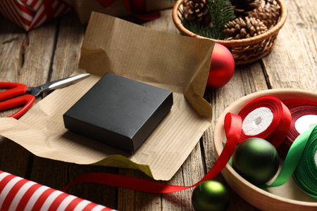 Christmas gift and wrapping materials on wooden background, closeupの写真素材