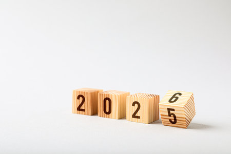 New year. Flipping cube with number 5 and 6 to make 2026 on light background, closeupの写真素材