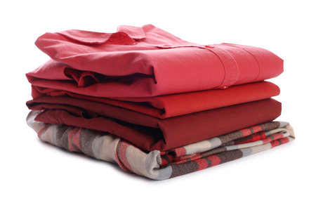 Stack of clean clothes isolated on whiteの写真素材