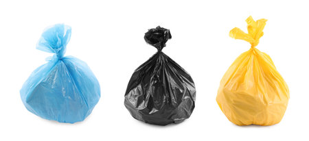 Set of colorful plastic bags full of garbage isolated on whiteの写真素材