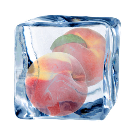 Fresh peaches in ice cube isolated on whiteの写真素材