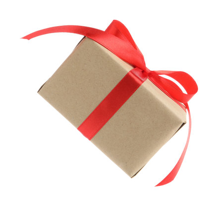 Beautiful gift box in air against white backgroundの写真素材