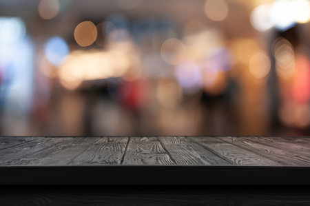 Empty wooden table against blurred background. Space for designの写真素材