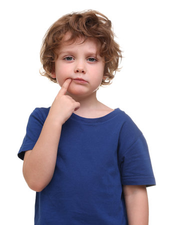 Portrait of cute little boy on white backgroundの写真素材