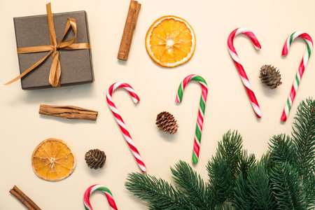 Flat lay composition with candy canes on beige background. Christmas treatの写真素材