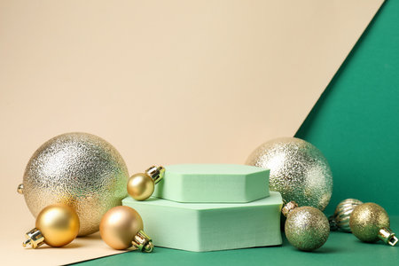 Empty podiums and Christmas decor on color background, space for textの写真素材