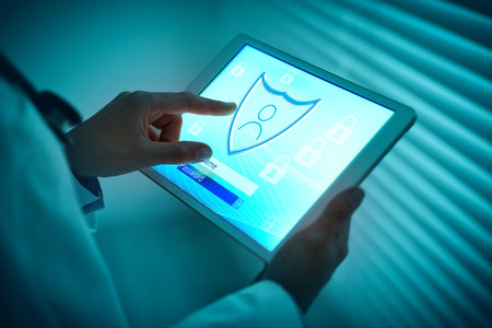 Doctor using tablet computer with shield on screen, closeup. Cyber security and data protection...