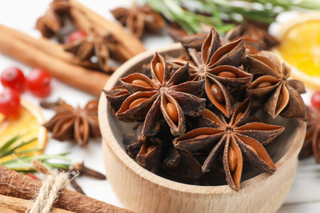 Different spices, dry orange slices, cranberries and fresh rosemary for mulled wine on light table, closeupの写真素材