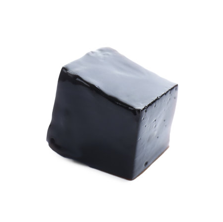 One cube of herbal jelly isolated on whiteの写真素材