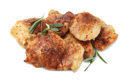 Tasty roasted chicken thighs with rosemary isolated on whiteの写真素材