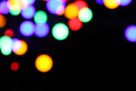 Bright lights on dark background, space for text. Bokeh effectの写真素材