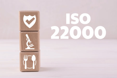 ISO 22000 Food safety management systems. Wooden cubes with different icons on white tableの写真素材