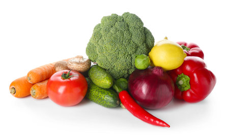 Pile of different fresh raw vegetables and lemon isolated on whiteの写真素材