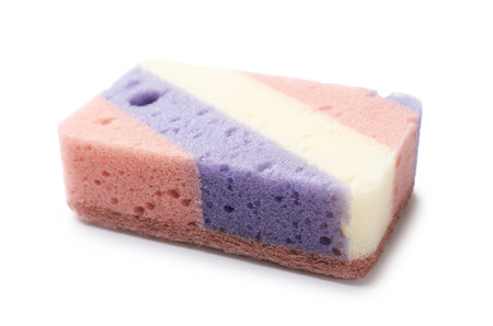 One colorful kitchen sponge isolated on whiteの写真素材