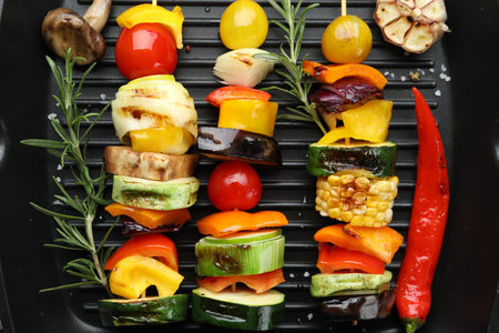 Skewers with tasty vegetables on grill pan, closeupの写真素材