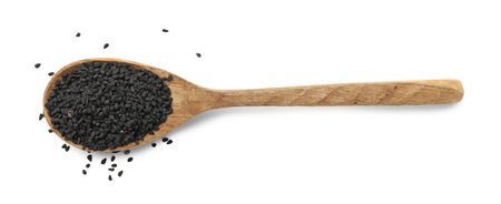 Black cumin seeds in spoon isolated on white, top viewの写真素材